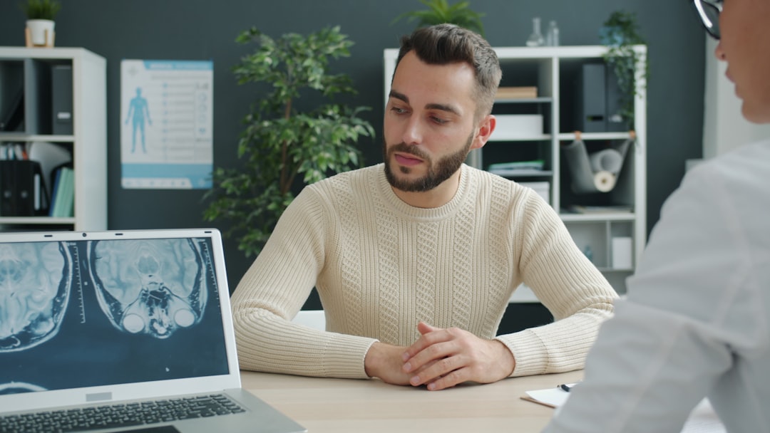 male patient in medical consultation with doctor - doctors that do vasectomies near me