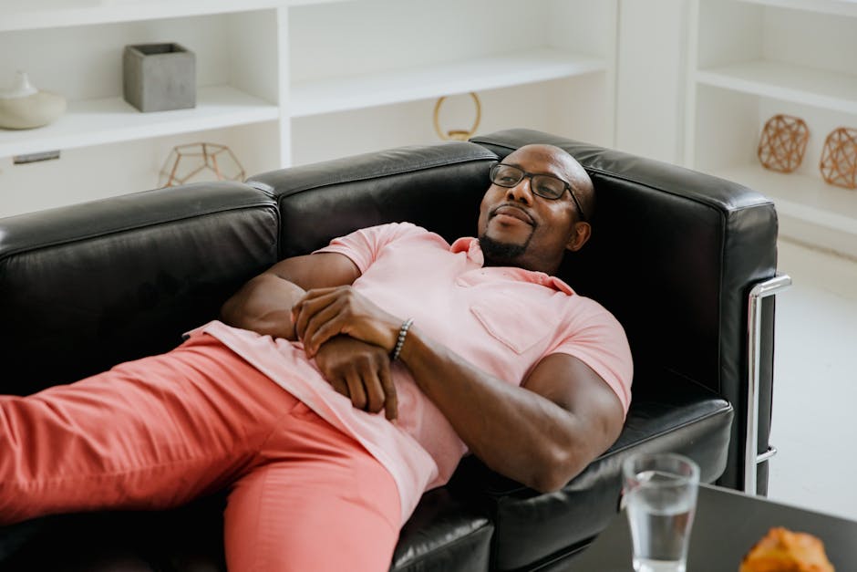 man resting comfortably at home after vasectomy recovery