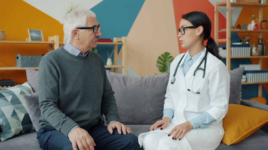 middle-aged man discussing health with a doctor