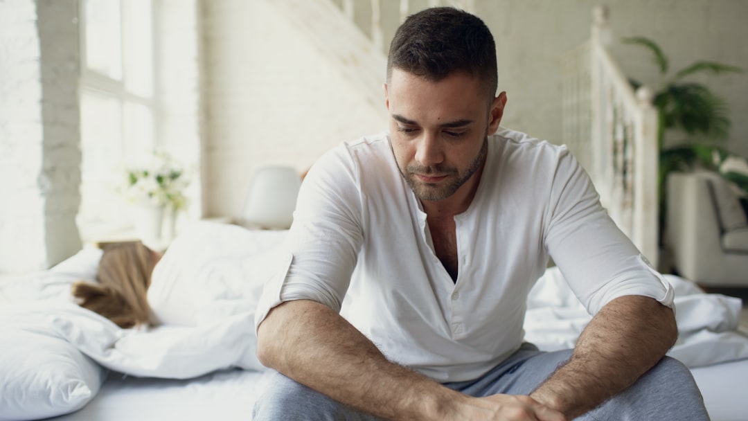 low testosterone in male symptoms man discussing with doctor